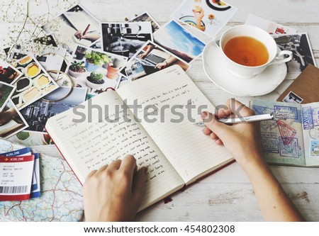 Hands Writing Travel Journal Tea Concept