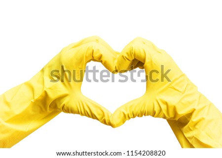 Woman’s hands in yellow rubber gloves in a shape of heart on white background. Isolated on white