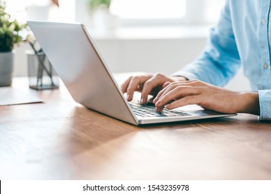 Hands of young contemporary office manager over laptop keypad during work over new business project by table - Shutterstock ID 1543235978