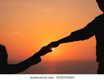 Hands of the young couple in love during sunset. Close up of diverse couple holding hands at beach during sunset. lifestyle, free time and vacation. Silhouette of couple, Expression of love feelings - Powered by Shutterstock