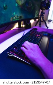 Hands Of A Young Gamer Playing Video Games In A Gaming Setup