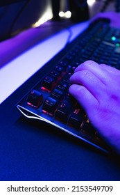 Hands Of A Young Gamer Playing Video Games In A Gaming Setup