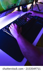 Hands Of A Young Gamer Playing Video Games In A Gaming Setup