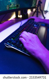 Hands Of A Young Gamer Playing Video Games In A Gaming Setup