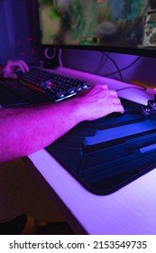 Hands Of A Young Gamer Playing Video Games In A Gaming Setup