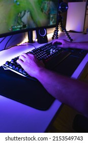 Hands Of A Young Gamer Playing Video Games In A Gaming Setup