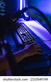 Hands Of A Young Gamer Playing Video Games In A Gaming Setup