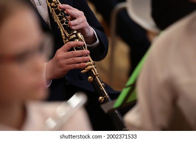 Hands Of A Young Musician On The Clarinet Close-Up. Band And School Orchestra Of Students - Powered by Shutterstock