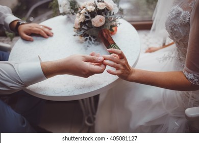 Hands of young wedding couple - Shutterstock ID 405081127
