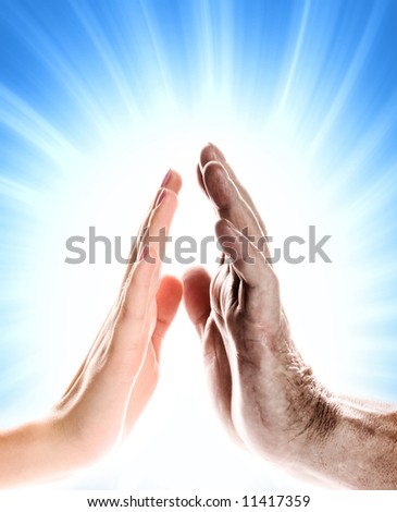 Men’s hands in the sunlight bruise the palms of their hands. High five close up.