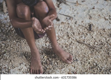 Hands,barefoot Do Not Wear Poor Child Begging You For Help In Slum. Concept For Poverty,beggar,homeless,poor,hunger,Human Rights. 