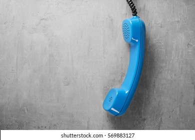 Handset From Landline Phone On The Background Wall