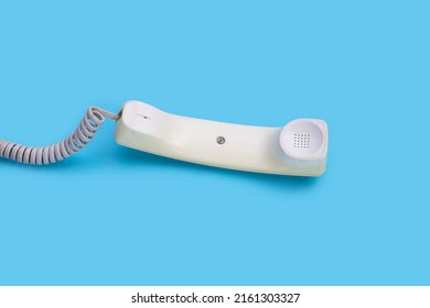 Handset Of Landline Phone On Blue Background.