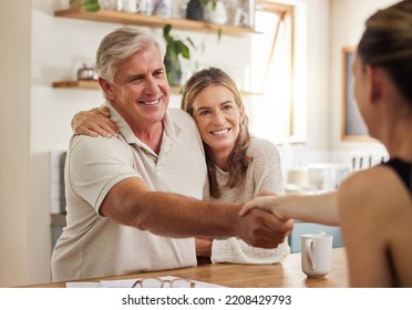 Handshake, Advice And Finance With A Senior Couple Planning Financial Savings Or Investment With A Broker At Home. Banking, Portfolio And Retirement With An Elderly Man And Woman Managing Growth