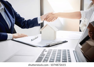 Handshake After Good Cooperation, Real Estate Broker Residential Agent Shaking Hands With Customer After Good Deal Agreement House Rent Listing Contract.