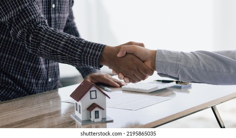 Handshake After Reaching A Real Estate Deal. Signing A House Rental Agreement.