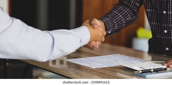 Handshake After Reaching A Real Estate Deal. Signing A House Rental Agreement.