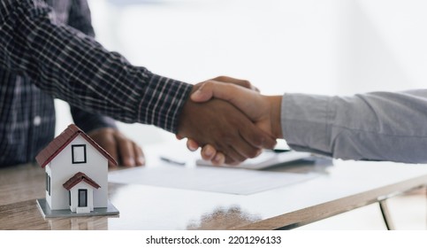 Handshake After Reaching A Real Estate Deal. Signing A House Rental Agreement.