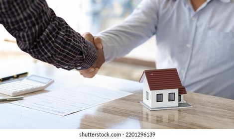 Handshake After Reaching A Real Estate Deal. Signing A House Rental Agreement.