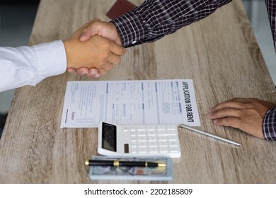 Handshake After Reaching A Real Estate Deal. Signing A House Rental Agreement.