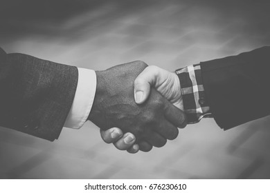 Handshake between black and white man