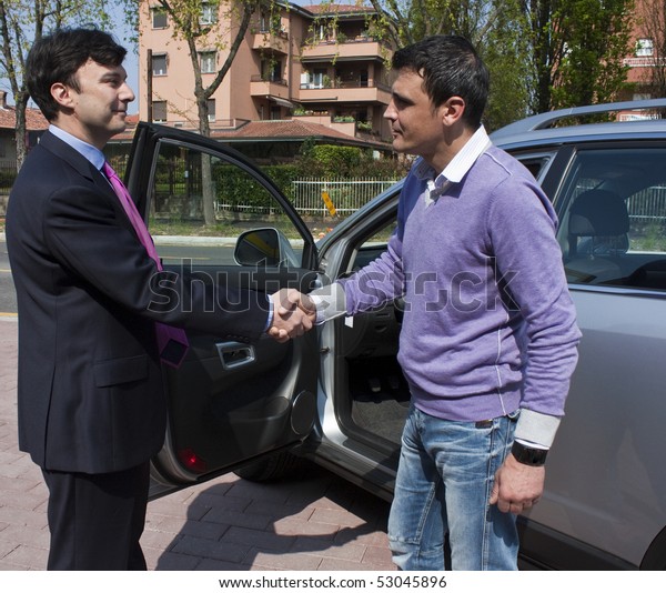 Handshake between\
customer and car\
salesperson