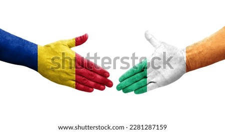 Handshake between Ireland and Romania flags painted on hands, isolated transparent image.