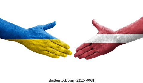 Handshake between Latvia and Ukraine flags painted on hands, isolated transparent image.