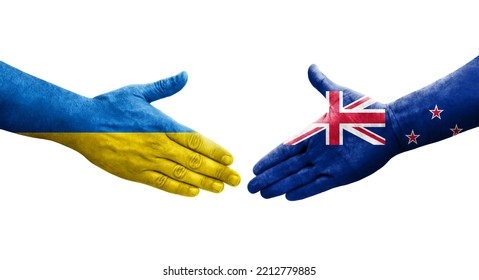 Handshake between New Zealand and Ukraine flags painted on hands, isolated transparent image.