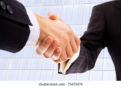 handshake of business partner after the deal