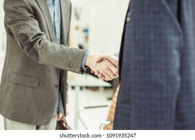 Handshake Of Business Partners Before Starting The Discussion Of A New Treaty