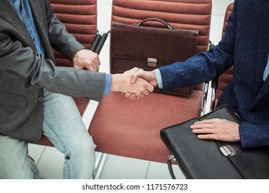 Handshake Of Business Partners Before Starting The Discussion Of A New Treaty