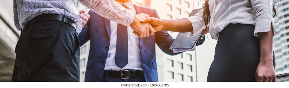 handshake of business People Colleagues Teamwork Meeting .Hold hand and shaking hand in city