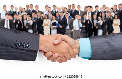 handshake businessmen, over big group of businesspeople background, hand shake concept of global international business collaboration, human resources, communication - Powered by Shutterstock