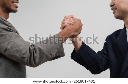 Handshake and Collaboration. Two professionals engaging in a handshake, symbolizing partnership and agreement.