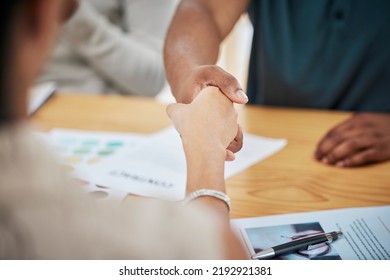 Handshake, contract deal or negotiation closeup at desk at a meeting between professionals. Business greeting, thank you or welcome gesture to show respect with new partnership or onboarding. - Shutterstock ID 2192921381