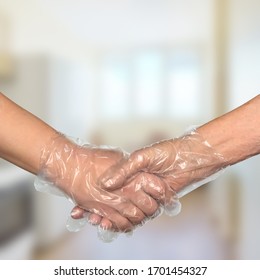 Handshake In Disposable Plastic Gloves