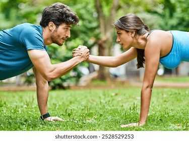 Handshake, fitness and couple in park for push up, workout or exercise for support, teamwork or challenge. Accountability, bonding or athletes on grass for balance, training or muscle growth together - Powered by Shutterstock