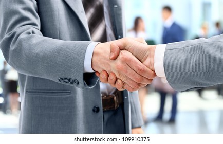 Handshake In Front Of Business People