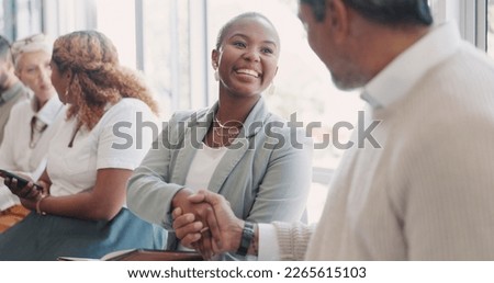 Handshake, hiring or people networking in waiting room before a recruitment job interview in an advertising agency. Partnership, relaxing or happy employees shaking hands, meeting or greeting in line