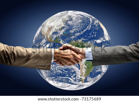 Handshake with map of the world in background