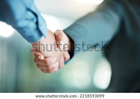 Handshake, meeting and business people in partnership, collaboration and working on a deal at work. Thank you, teamwork and workers shaking hands, giving a welcome and motivation in an office