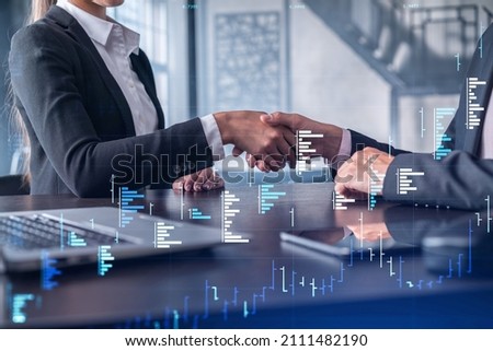 A handshake as a symbol of successful transaction on brokerage services at international investment bank. Capital market, stock trading. Financial hologram chart. Women in business.