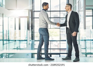Handshake, teamwork and working together with corporate business men and colleagues at work as a team. Making a deal during a meeting, greeting and coming to an agreement in a modern office - Powered by Shutterstock