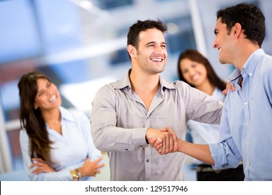 Handshake of two business men closing a deal at the office - Powered by Shutterstock