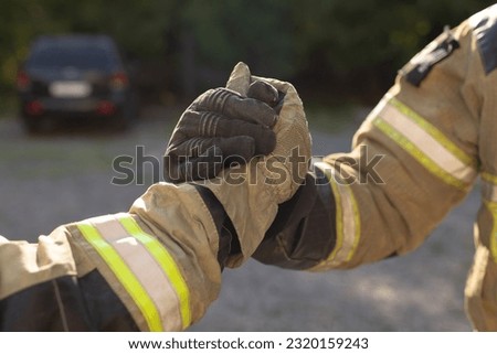 handshake of two firefighters. close-up image