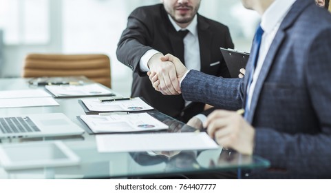  handshake of two lawyers after discussing the terms of a financial contract - Shutterstock ID 764407777
