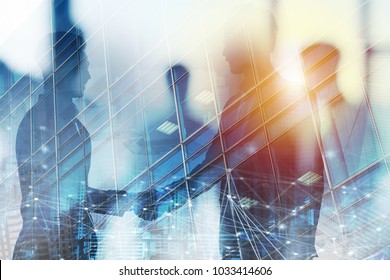 Handshaking business person in office with network effect. concept of teamwork and partnership. double exposure - Shutterstock ID 1033414606