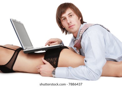 Handsom young businessman works on notebook standing on pretty woman's bum