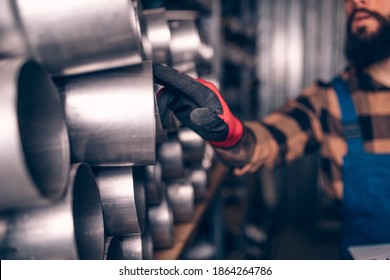 Handsome Adult Man Working In Car And Truck Spare Parts Warehouse. 